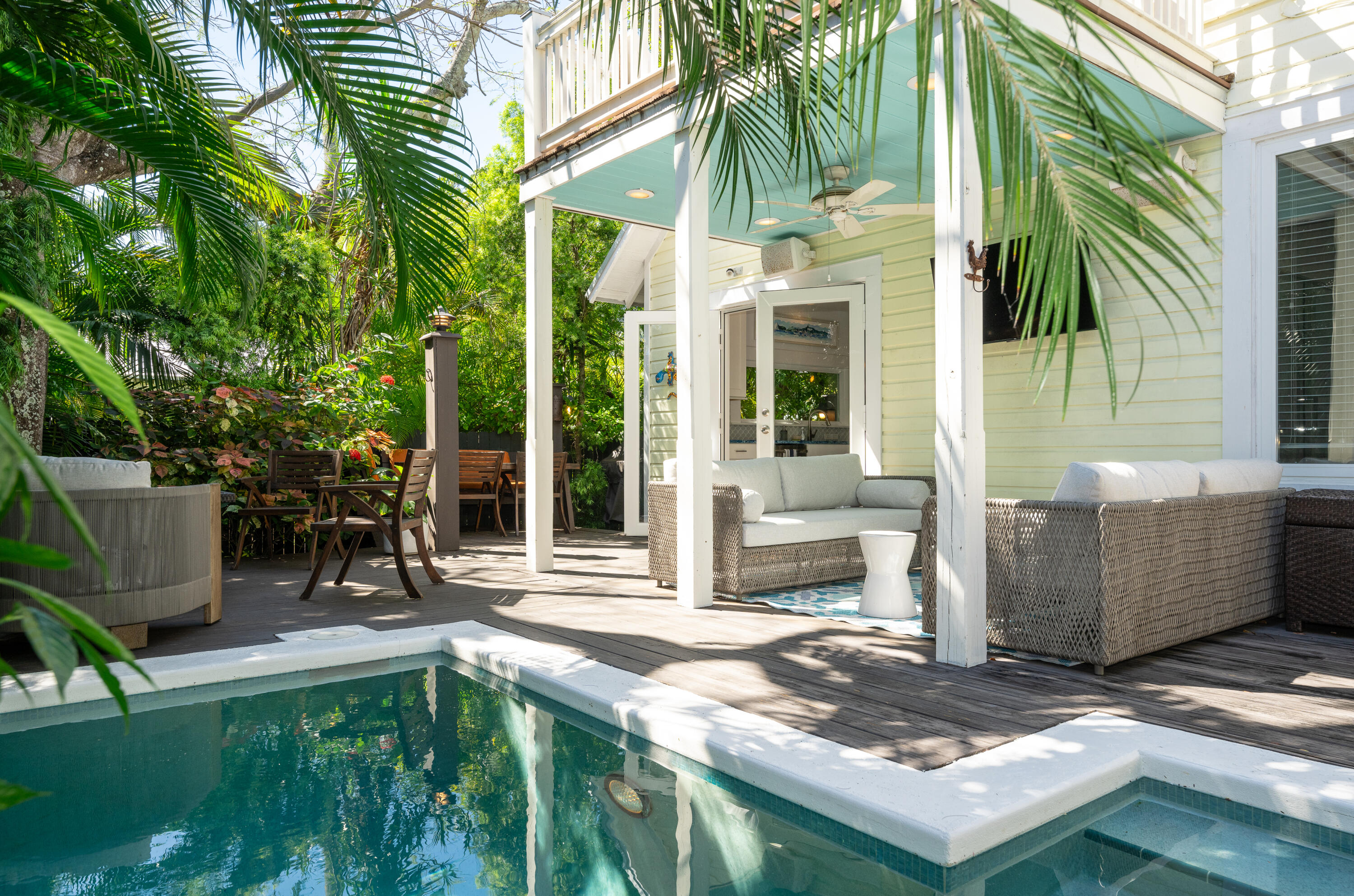 a view of house with backyard outdoor seating and barbeque oven