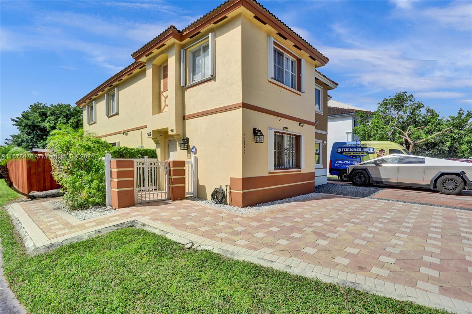 a front view of a house with a yard