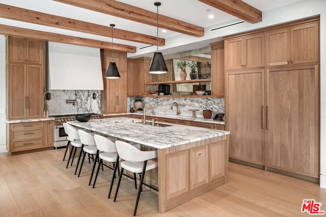 a kitchen with a table and chairs in it