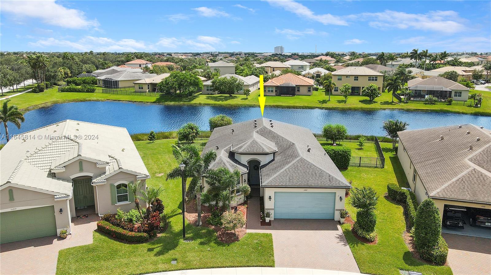 an aerial view of a house with a swimming pool yard and outdoor seating