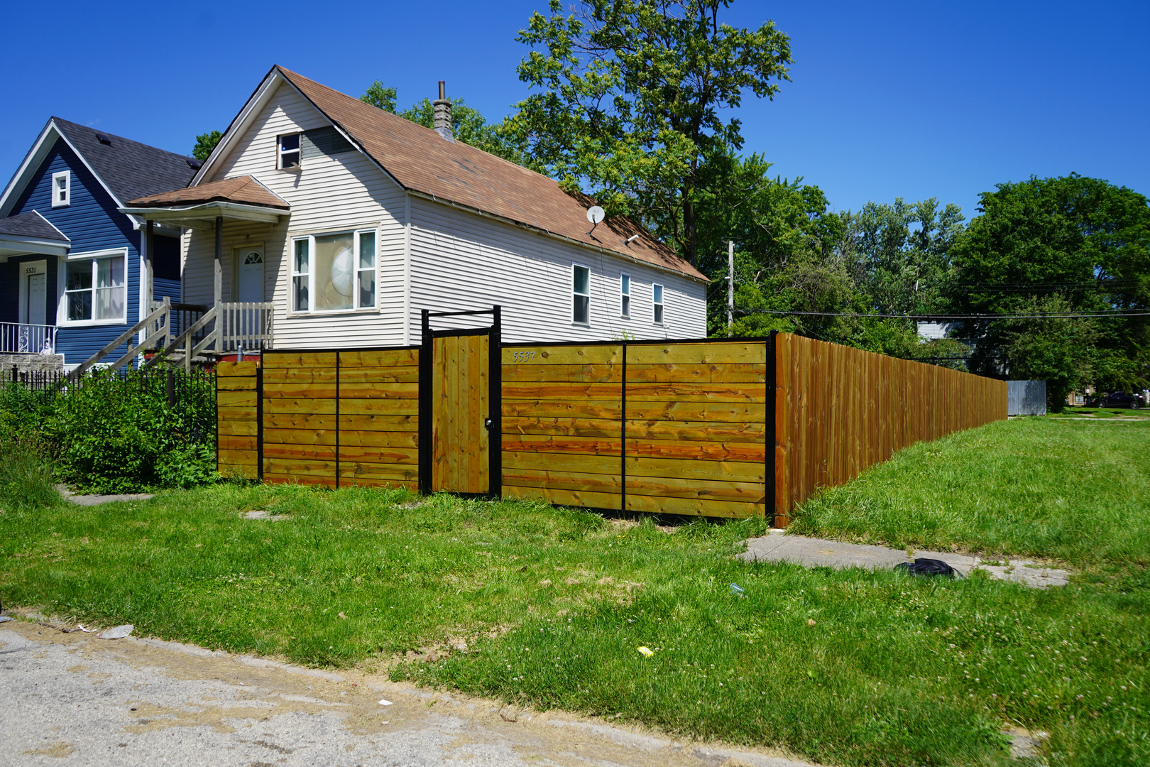 a view of a backyard of the house