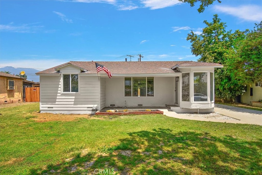 front view of a house with a yard