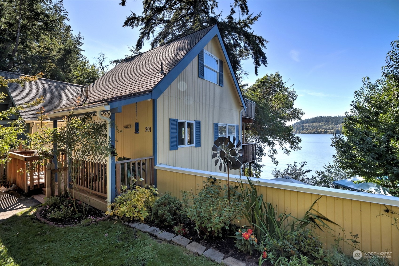 a view of a house with a yard and a garden