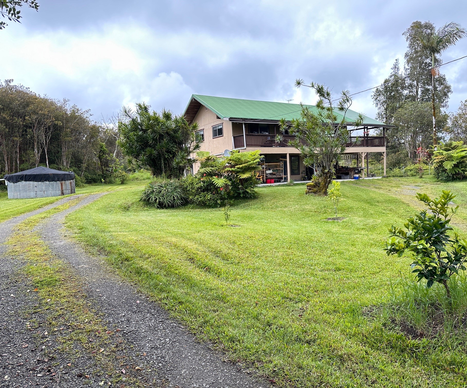 a view of a house with a yard porch and sitting area