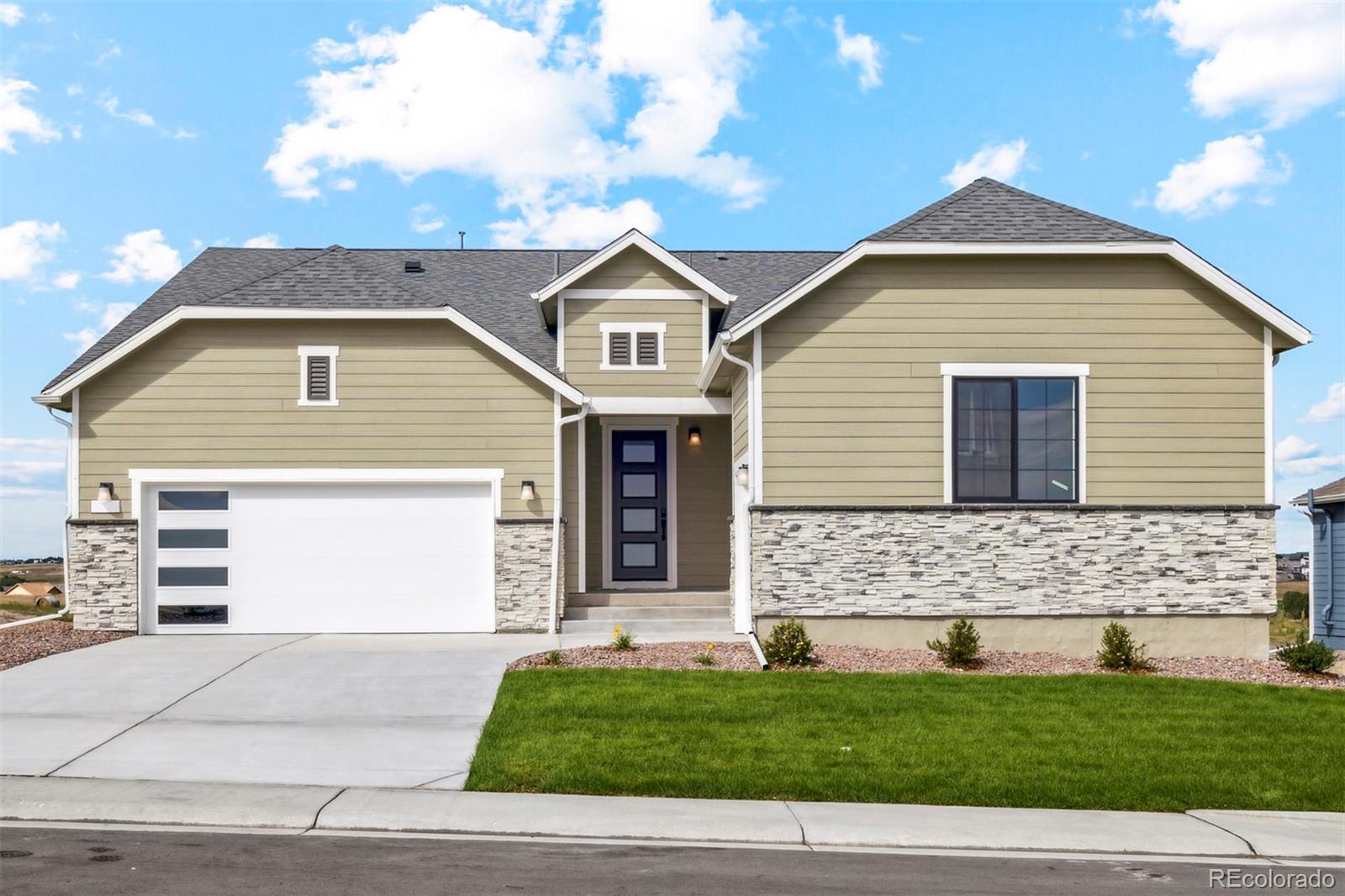 a front view of a house with a yard