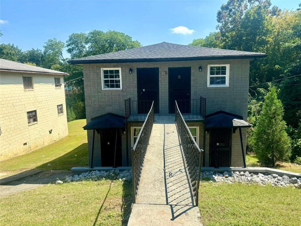 a front view of a house with a yard