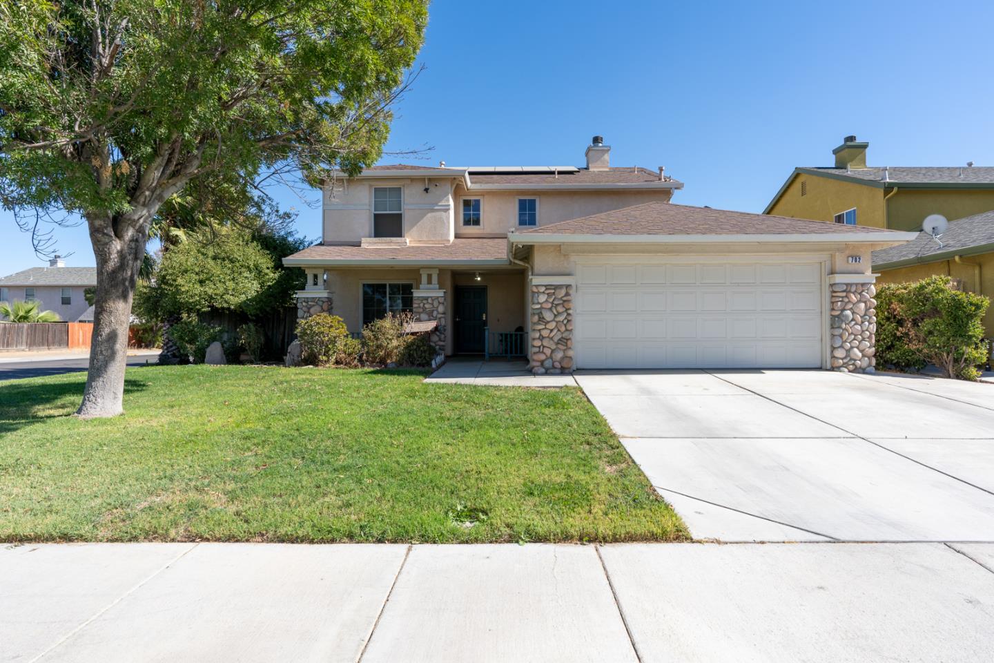 front view of a house with a yard