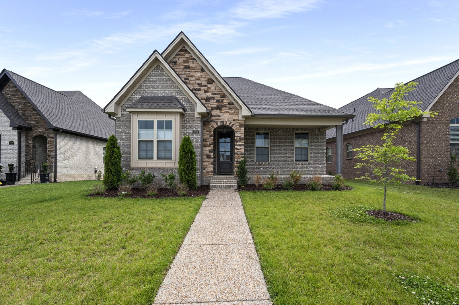 a front view of a house with a yard