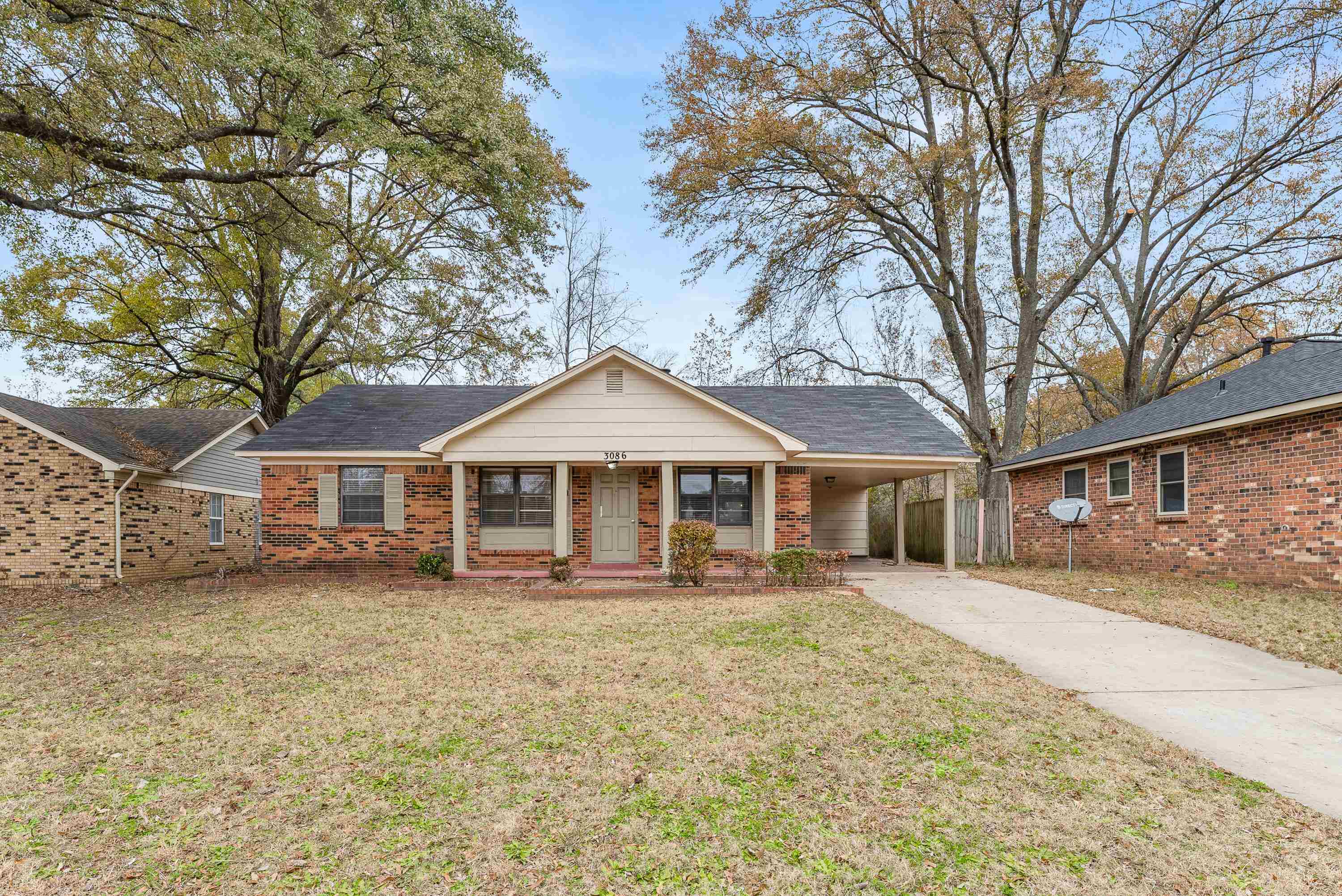 front view of a house with a yard