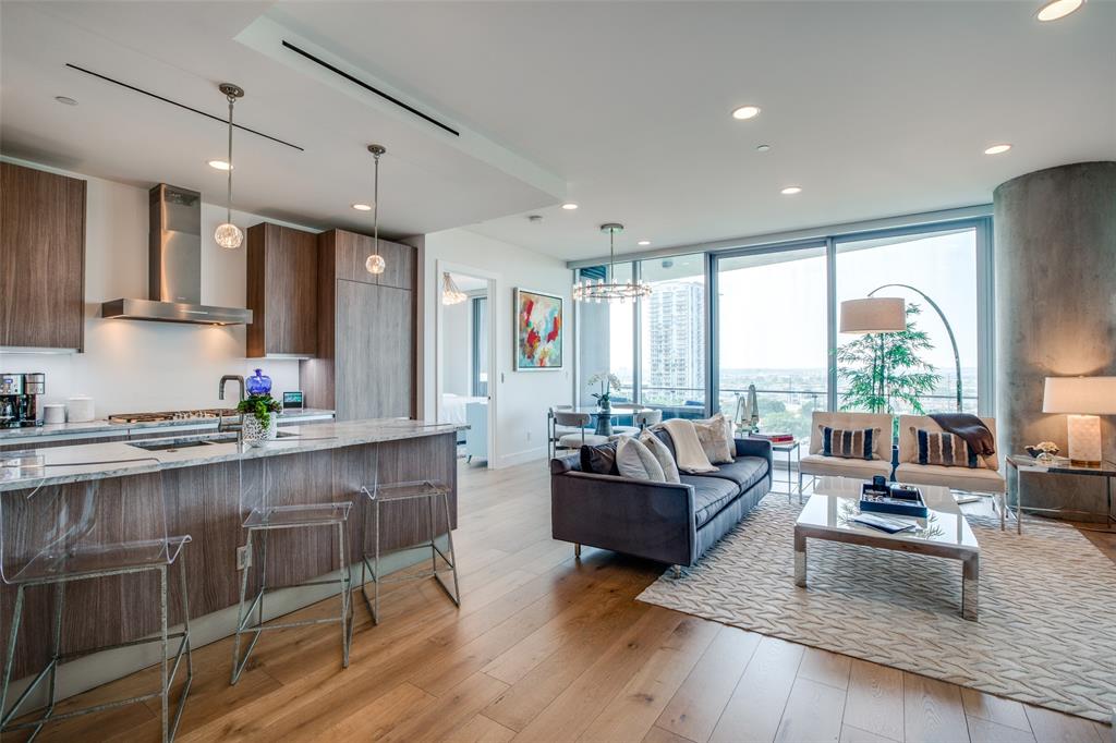 a living room with furniture window and wooden floor