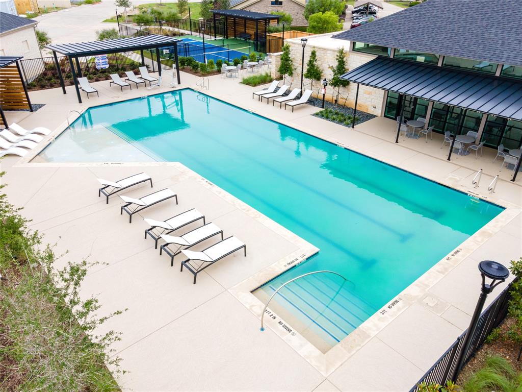 a view of a swimming pool with a patio