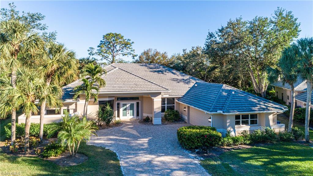 Single story home with a front yard