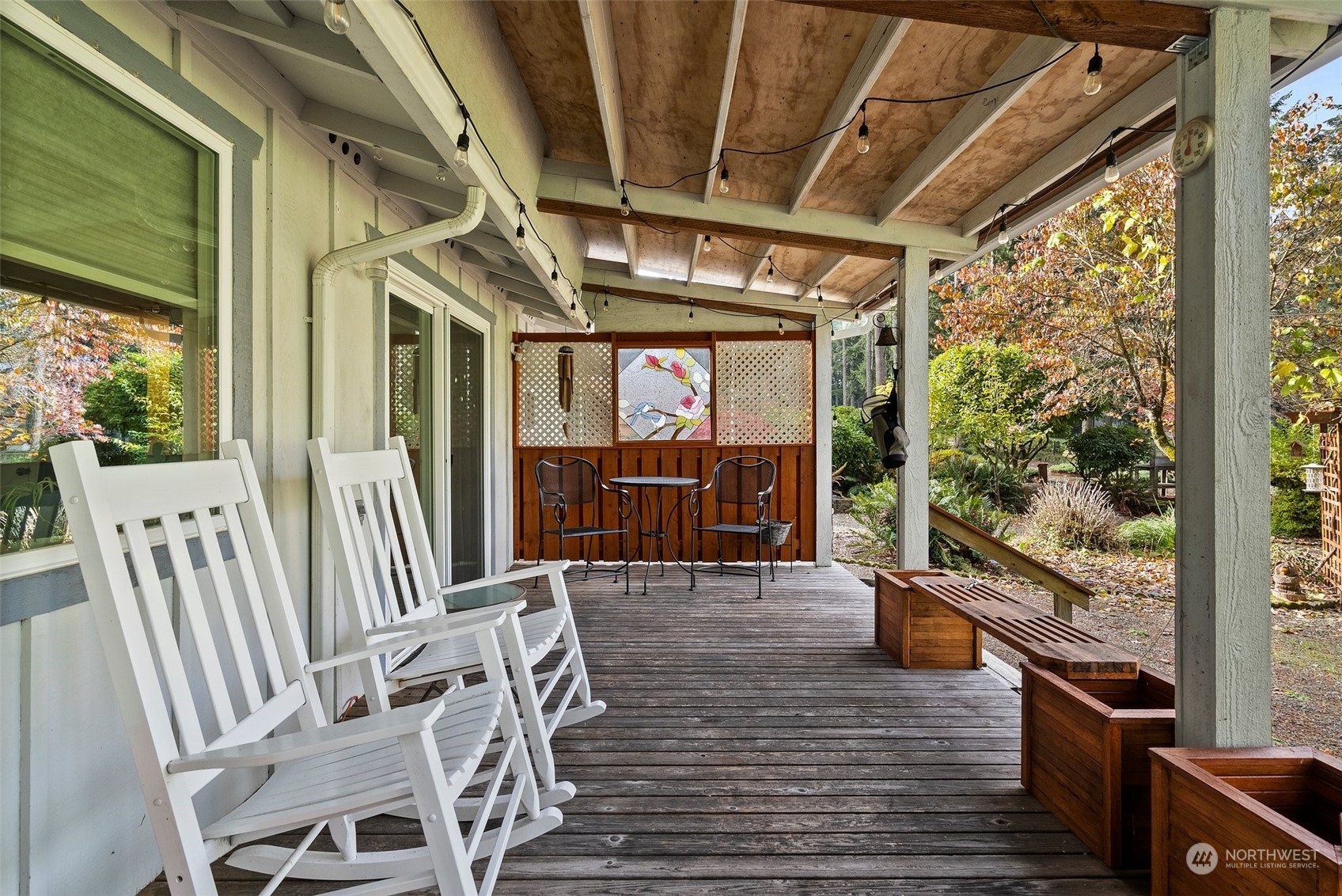 a view of a chairs and table in the balcony