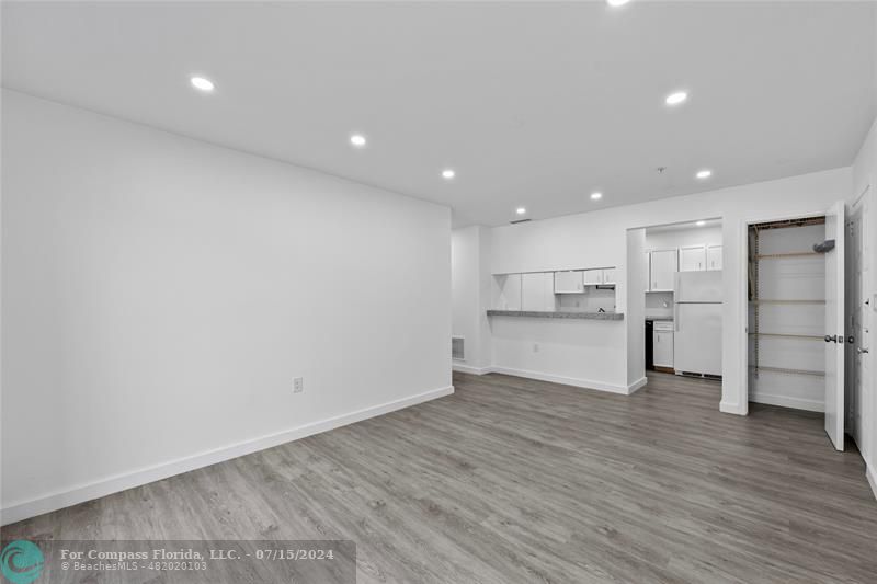 a view of kitchen entryway with wooden floor