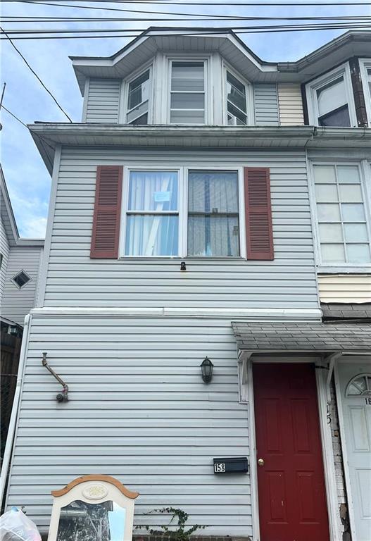 a view of a house with a door and a large window