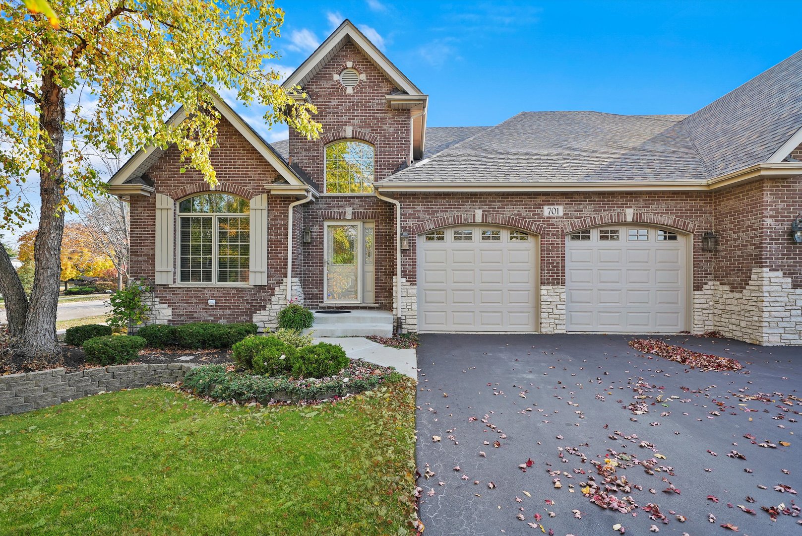 a front view of a house with a yard