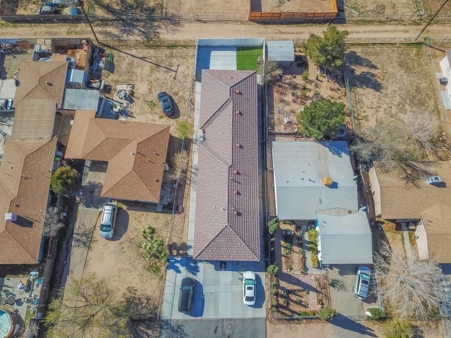 an aerial view of houses with outdoor space