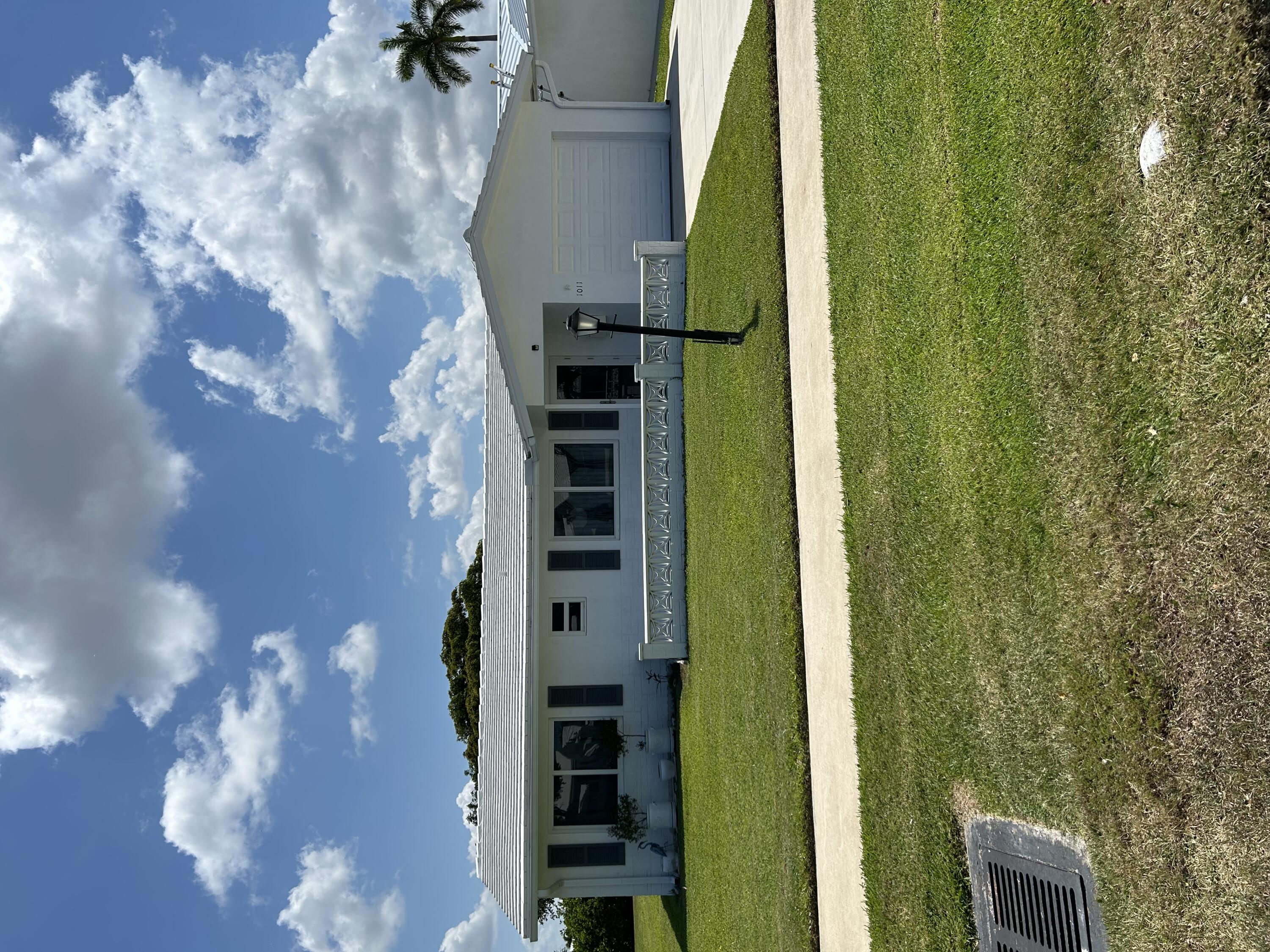 a view of house with a big yard