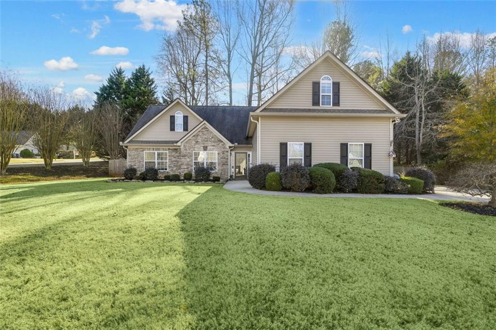 a front view of a house with garden