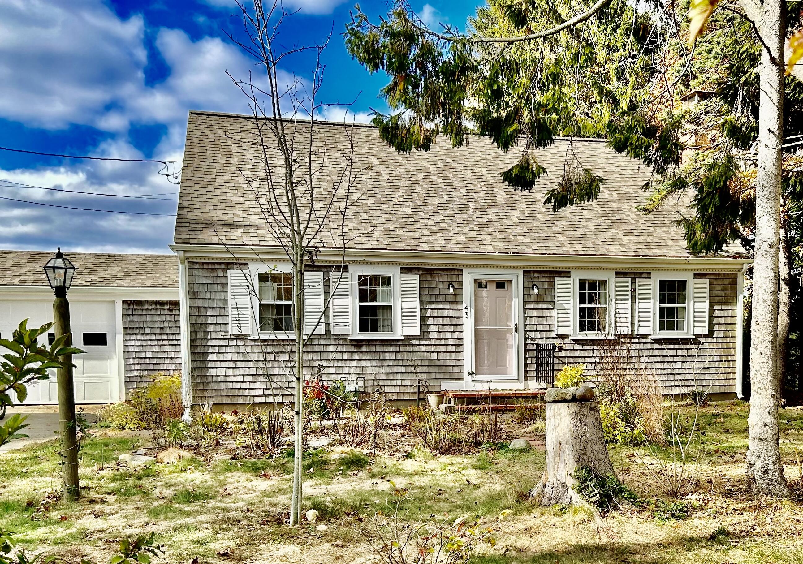 a view of a brick house with many windows