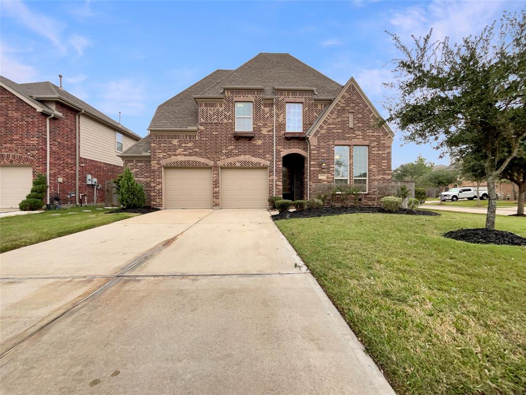 a front view of a house with yard