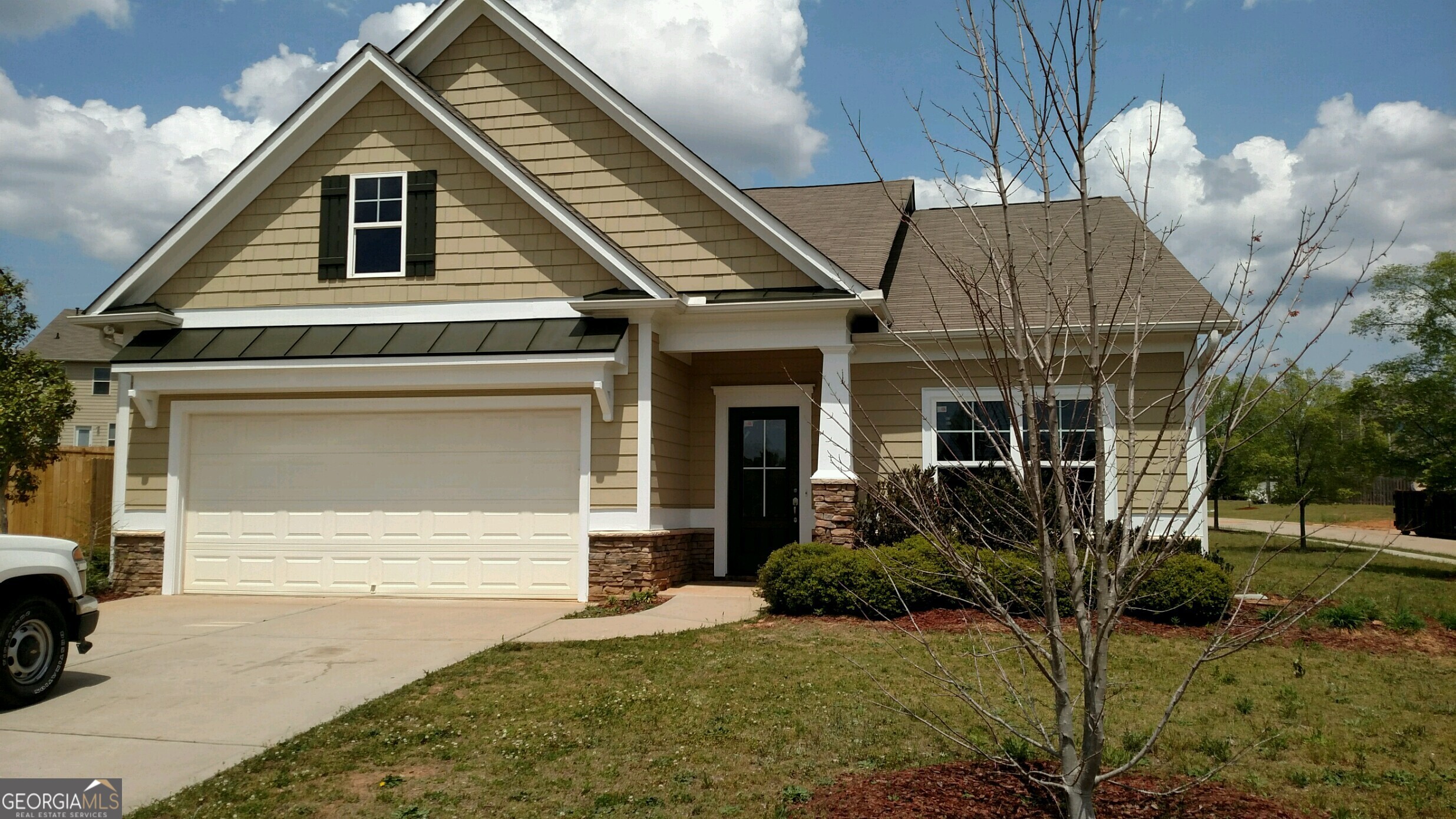 a front view of a house with garden