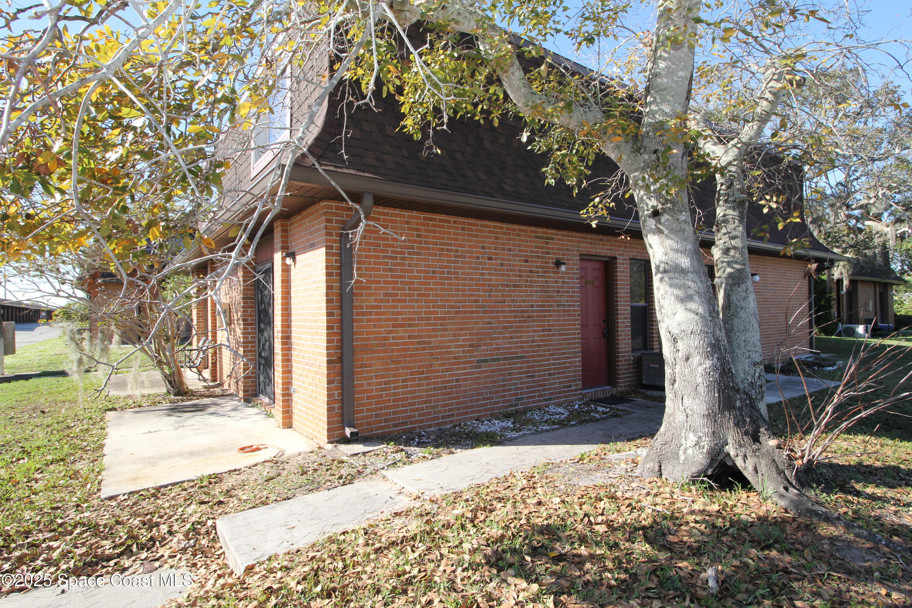 a house with trees in front of it