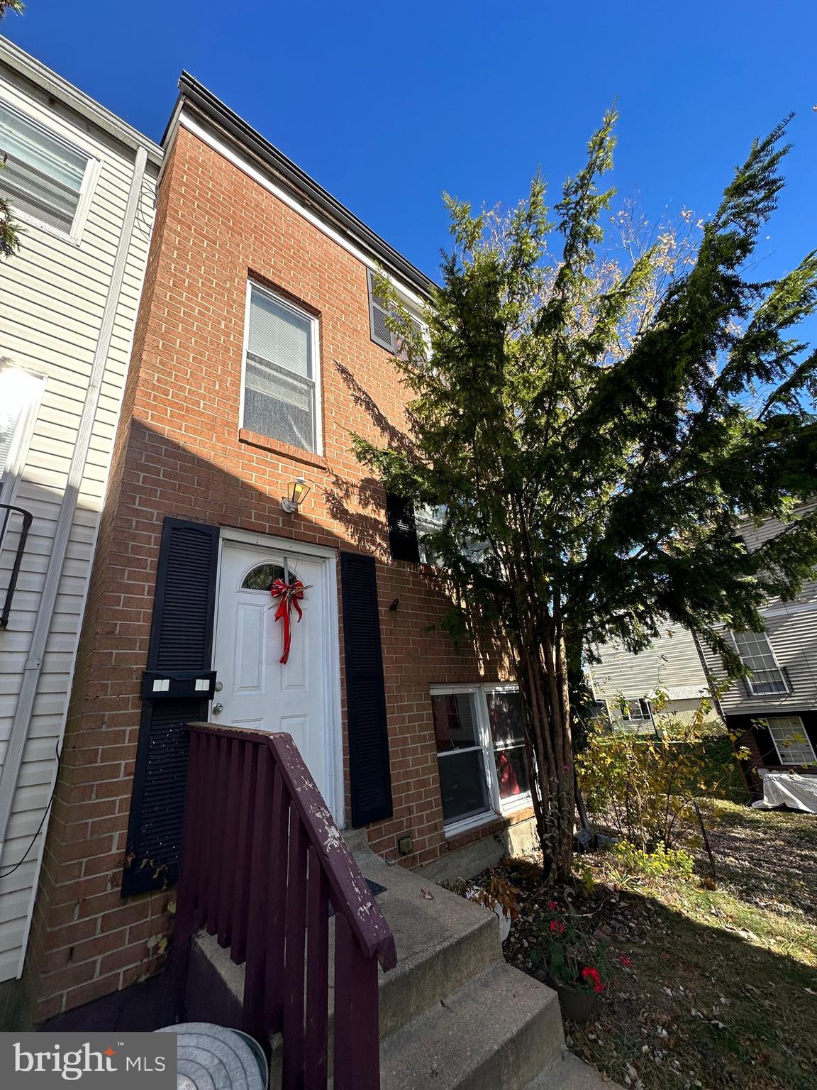 a view of a house with a tree