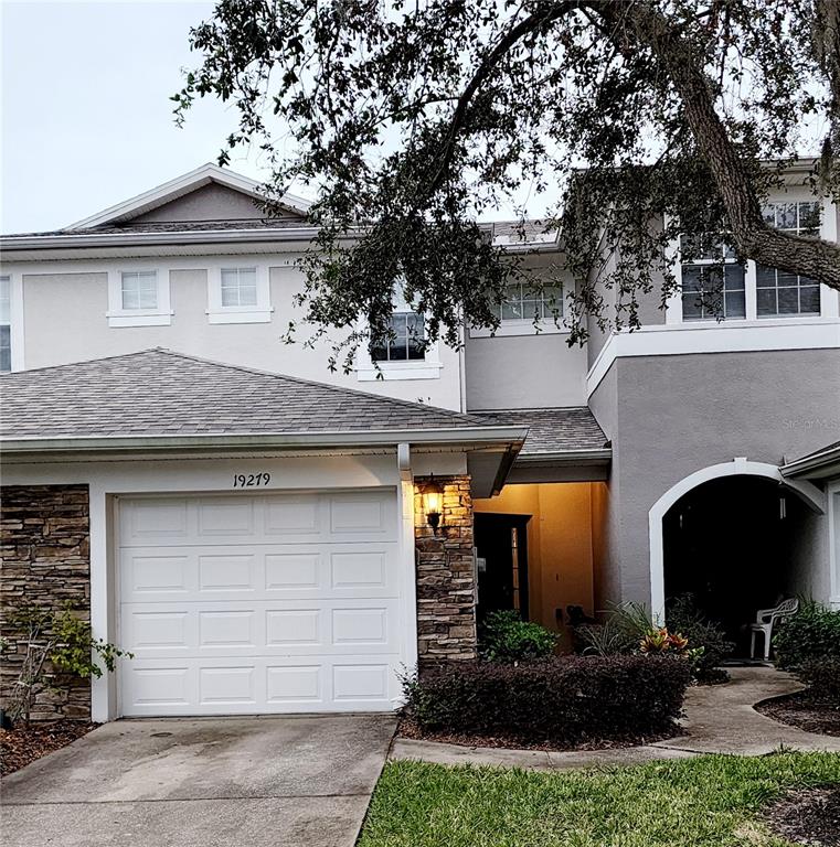 a front view of a house with a garage