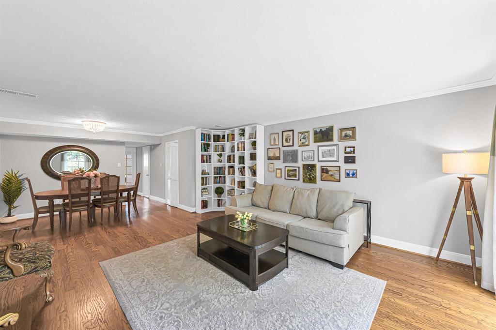 Luxurious wood flooring and crown molding welcome you inside this unit, complemented by a neutral, calming paint palette creating a serene living space.