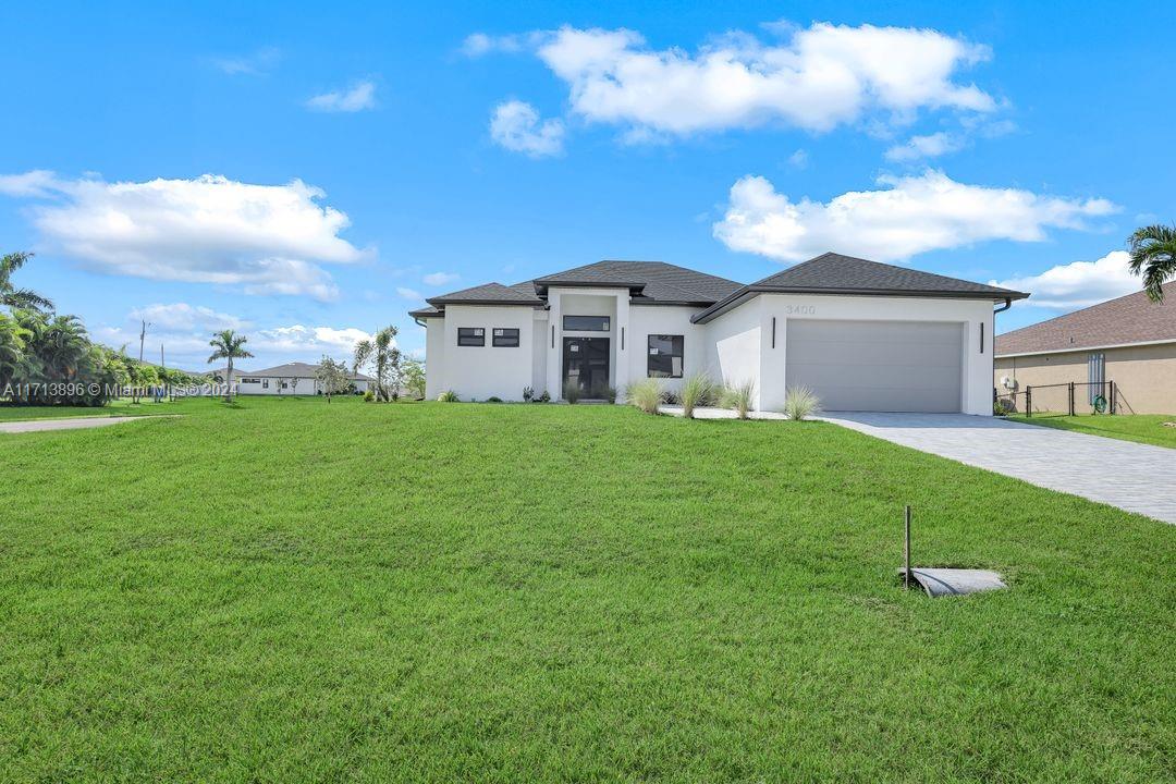 a front view of a house with a yard