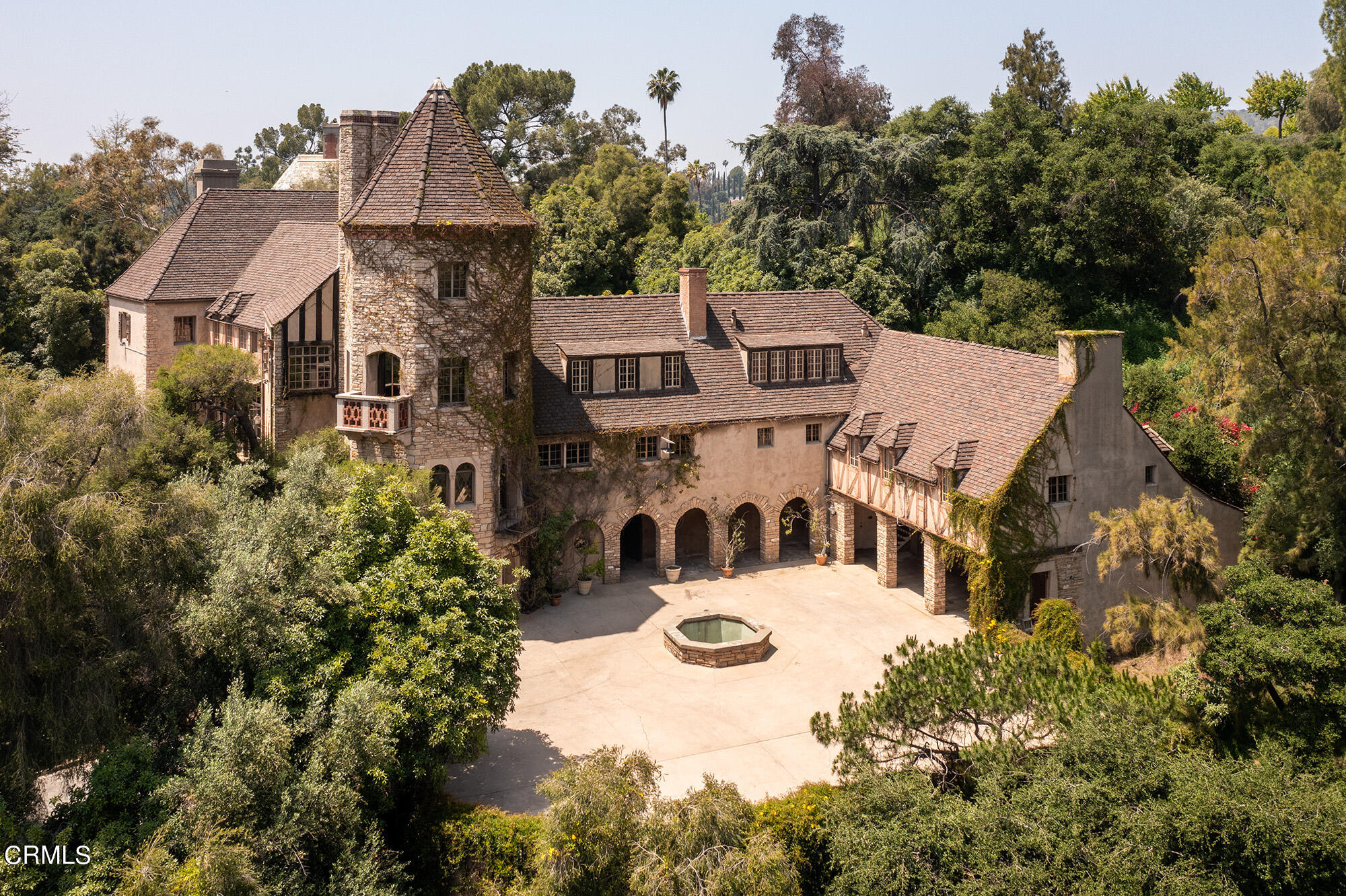 an aerial view of a house with yard swimming pool and outdoor seating