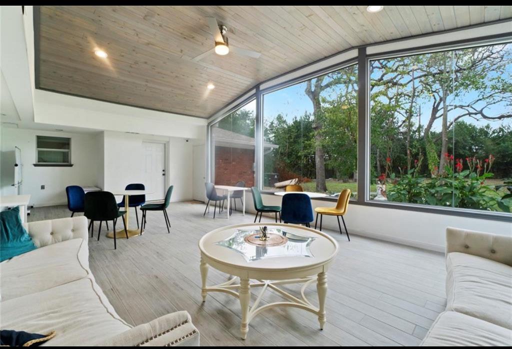 a view of a dining room with furniture window and outside view