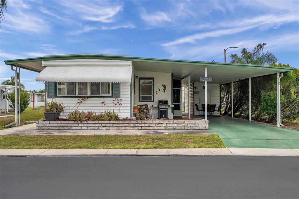 a view of a house with swimming pool and a yard