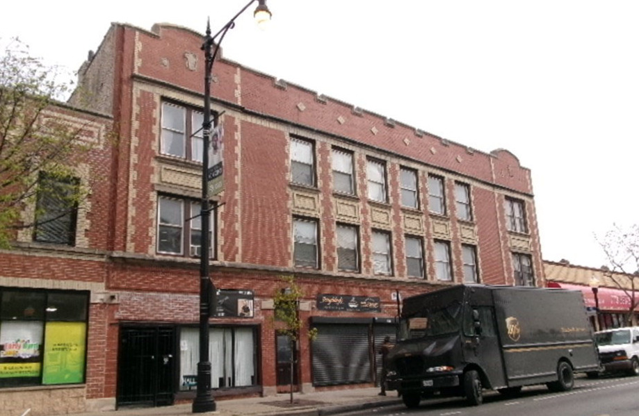 a view of a building with a street