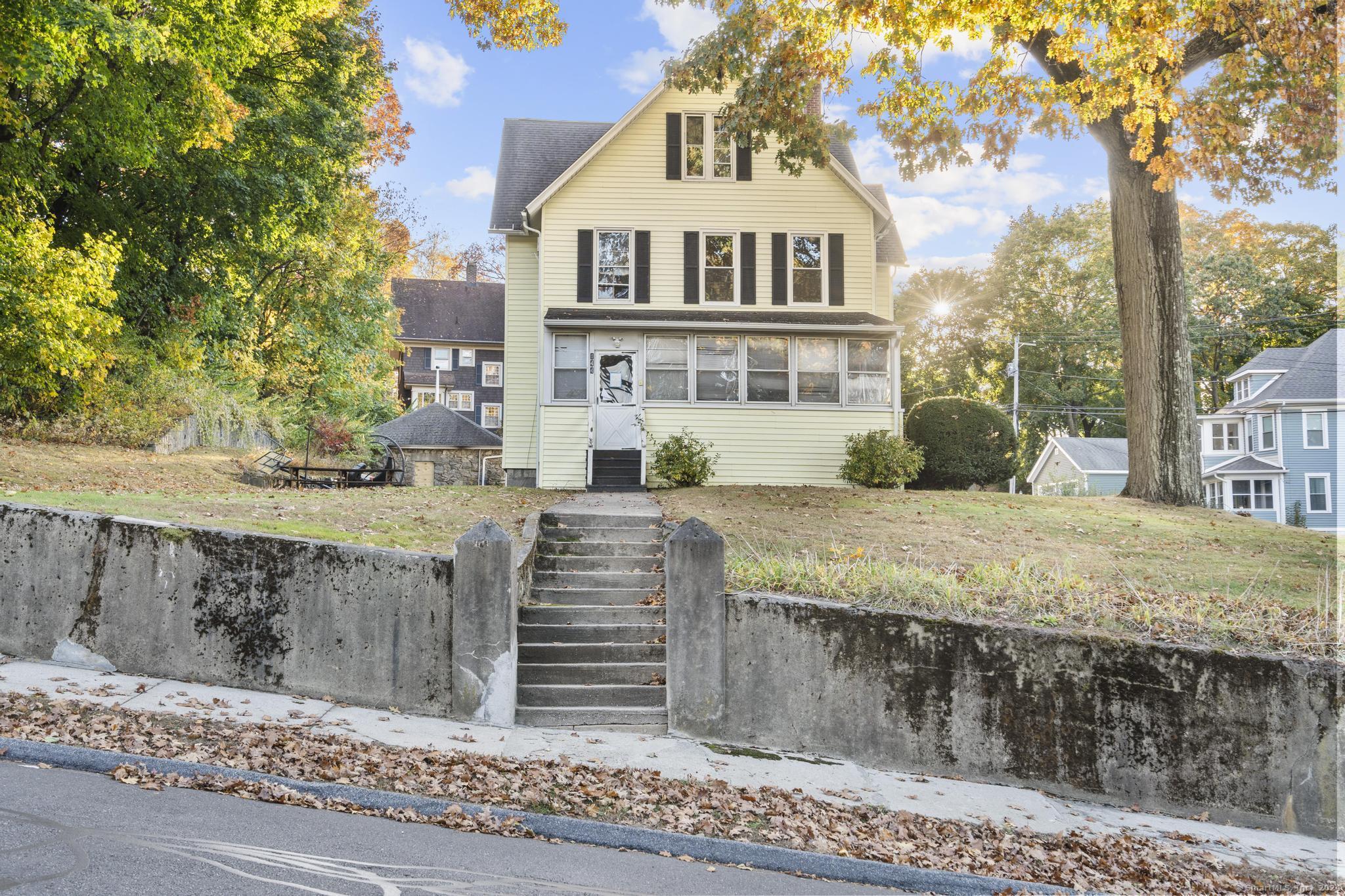 a front view of a house with a yard