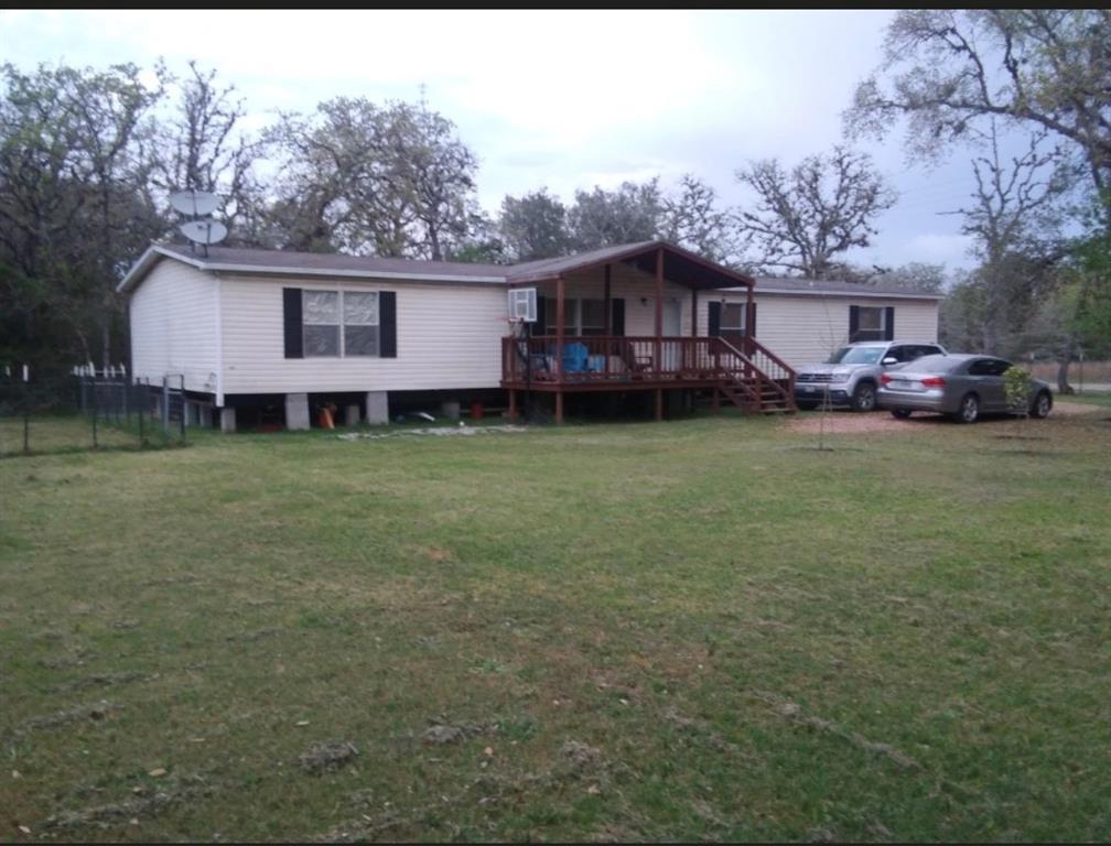 a view of a yard in front of a house