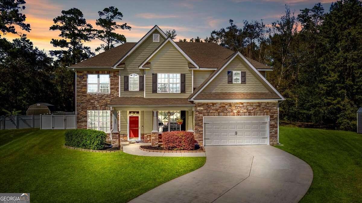 a front view of a house with a yard