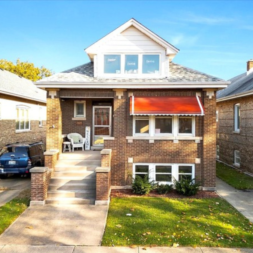 a house view with a sitting space and garden space