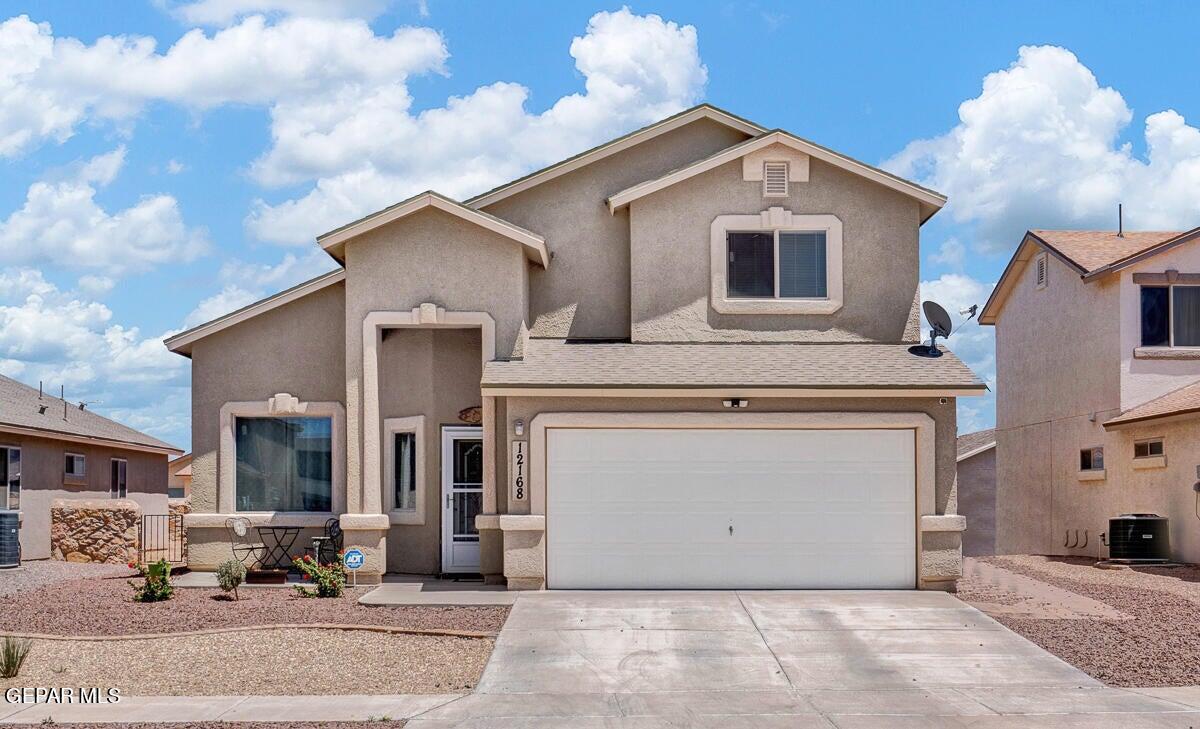 a front view of a house with a garage