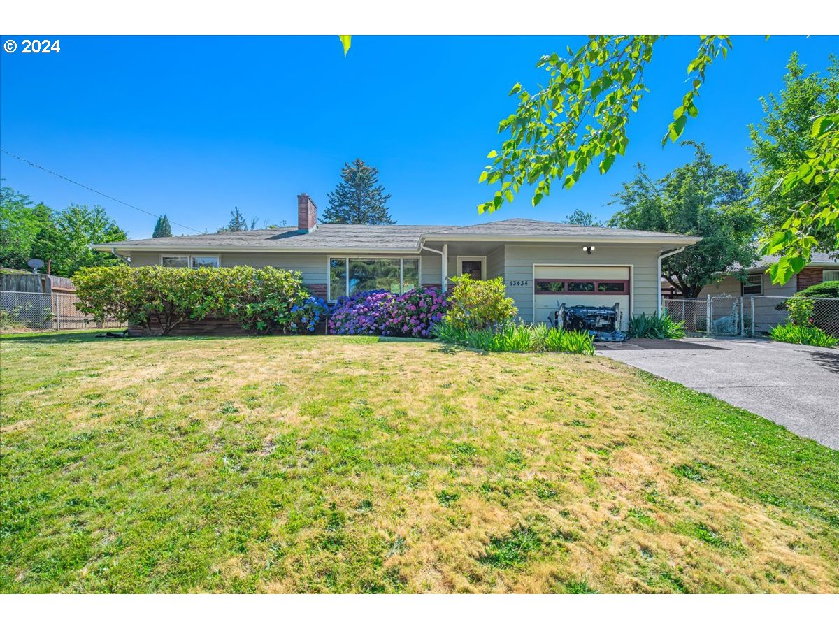 a view of house with yard and outdoor space