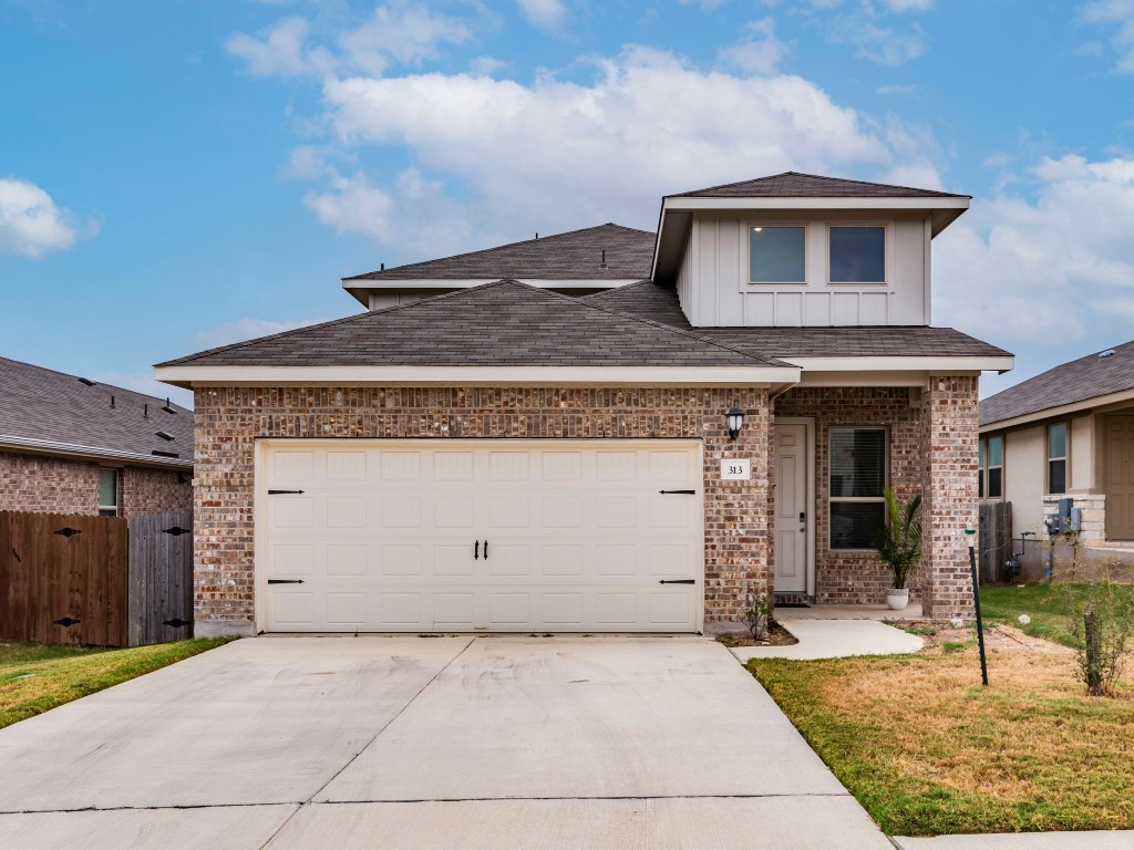 a view of a house with garage