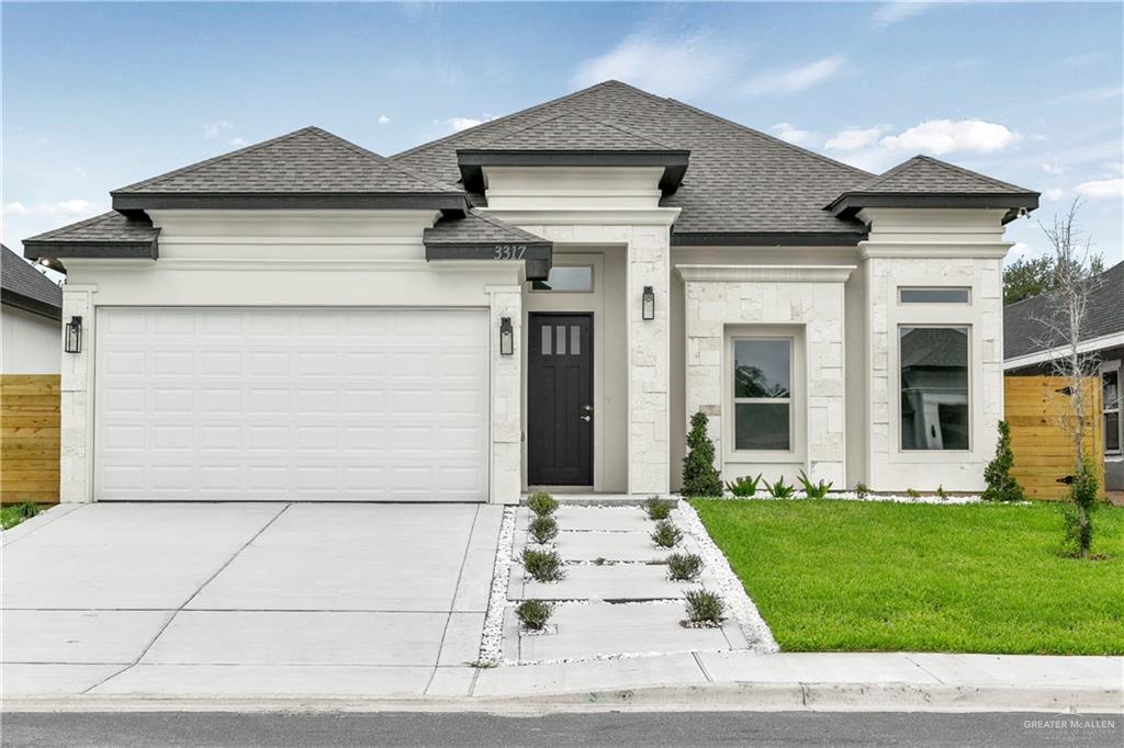 front view of a house with a yard