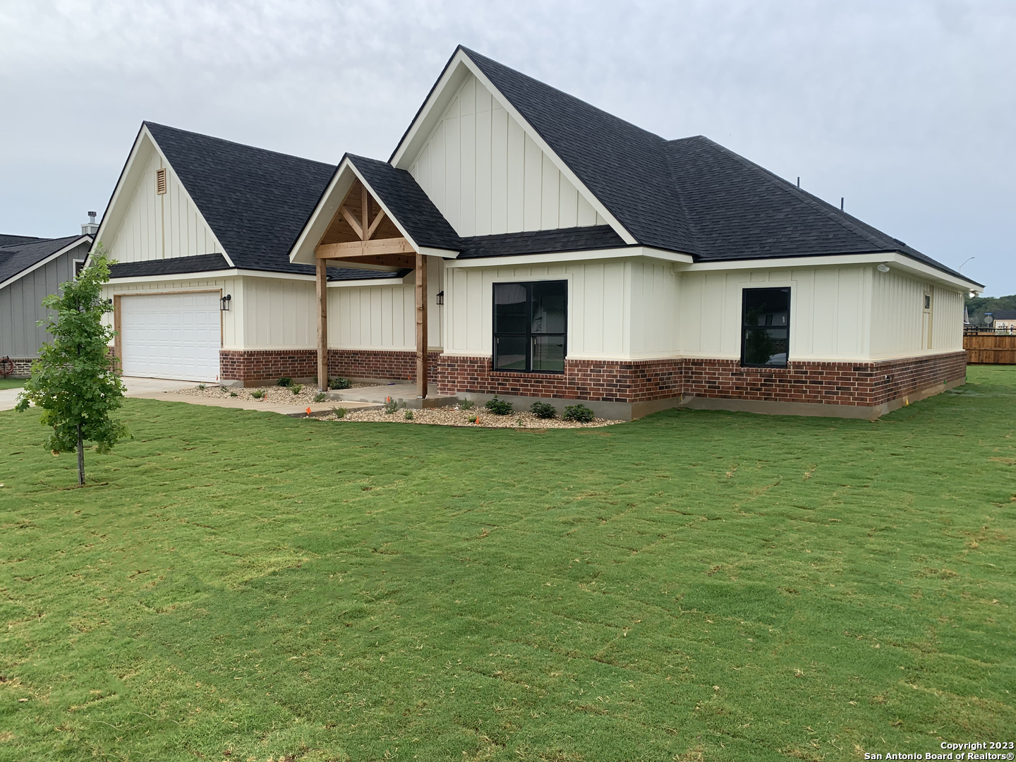 a front view of house with yard and green space