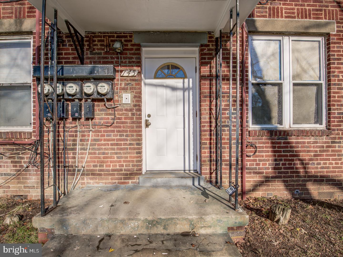 a front view of a house with parking area