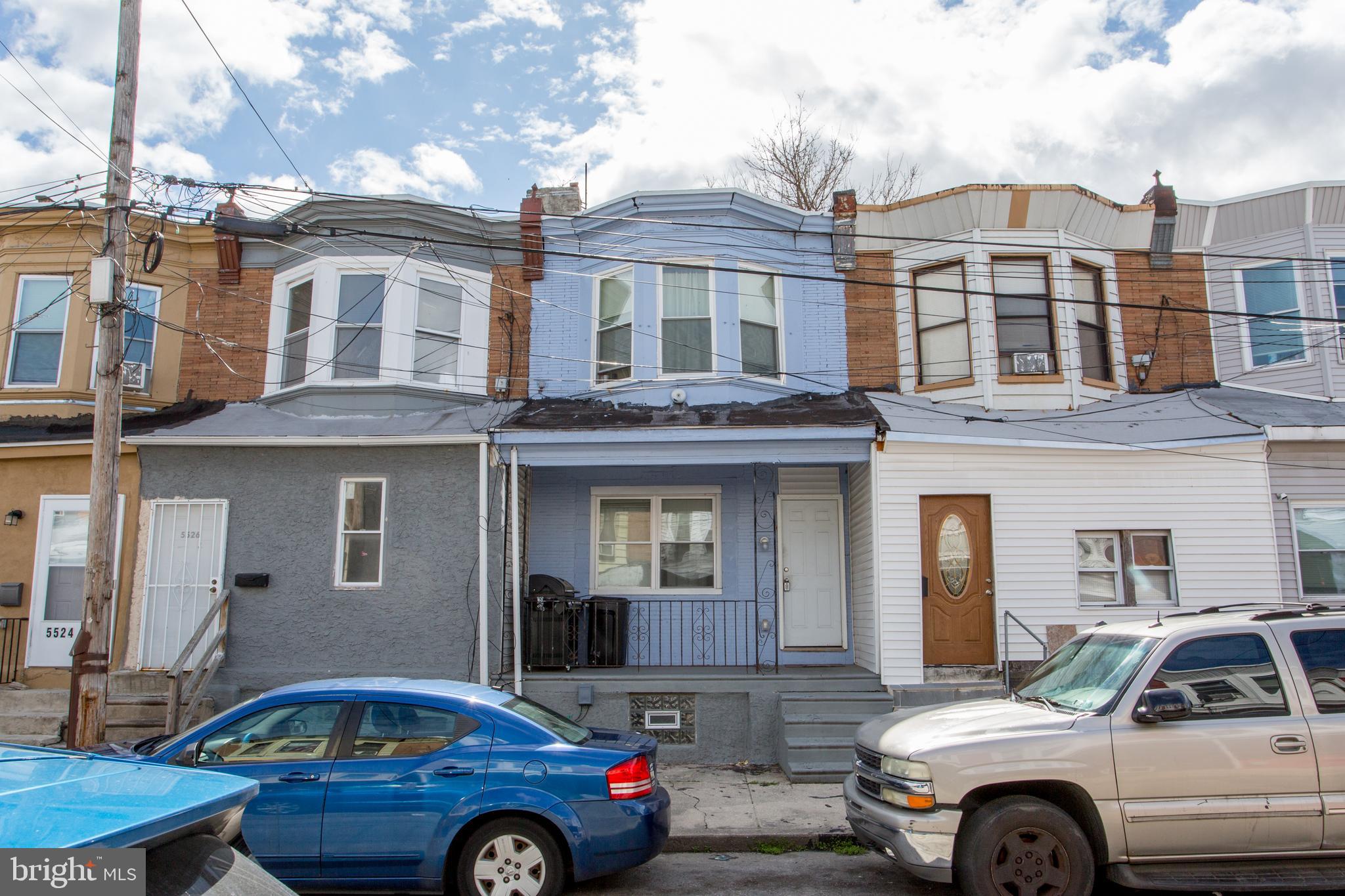 a front view of a house with parking space