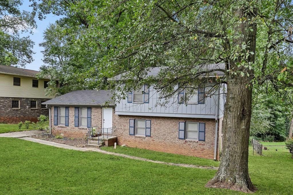 a front view of a house with a yard