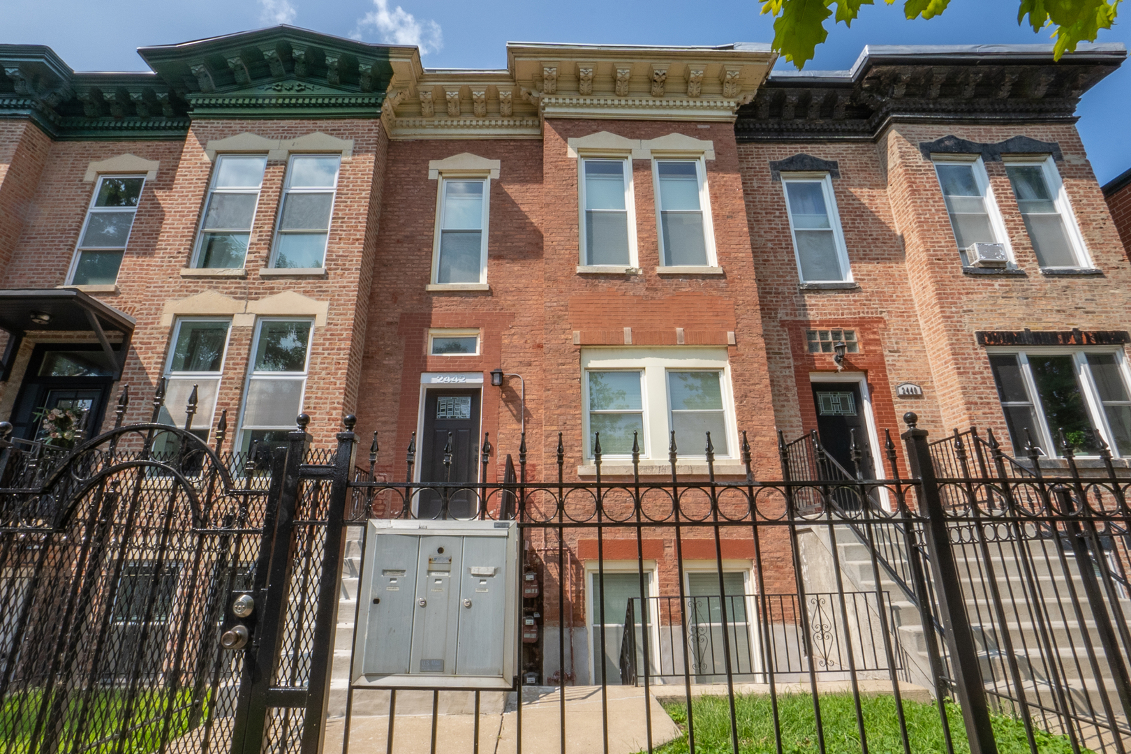 a view of a brick building with many windows