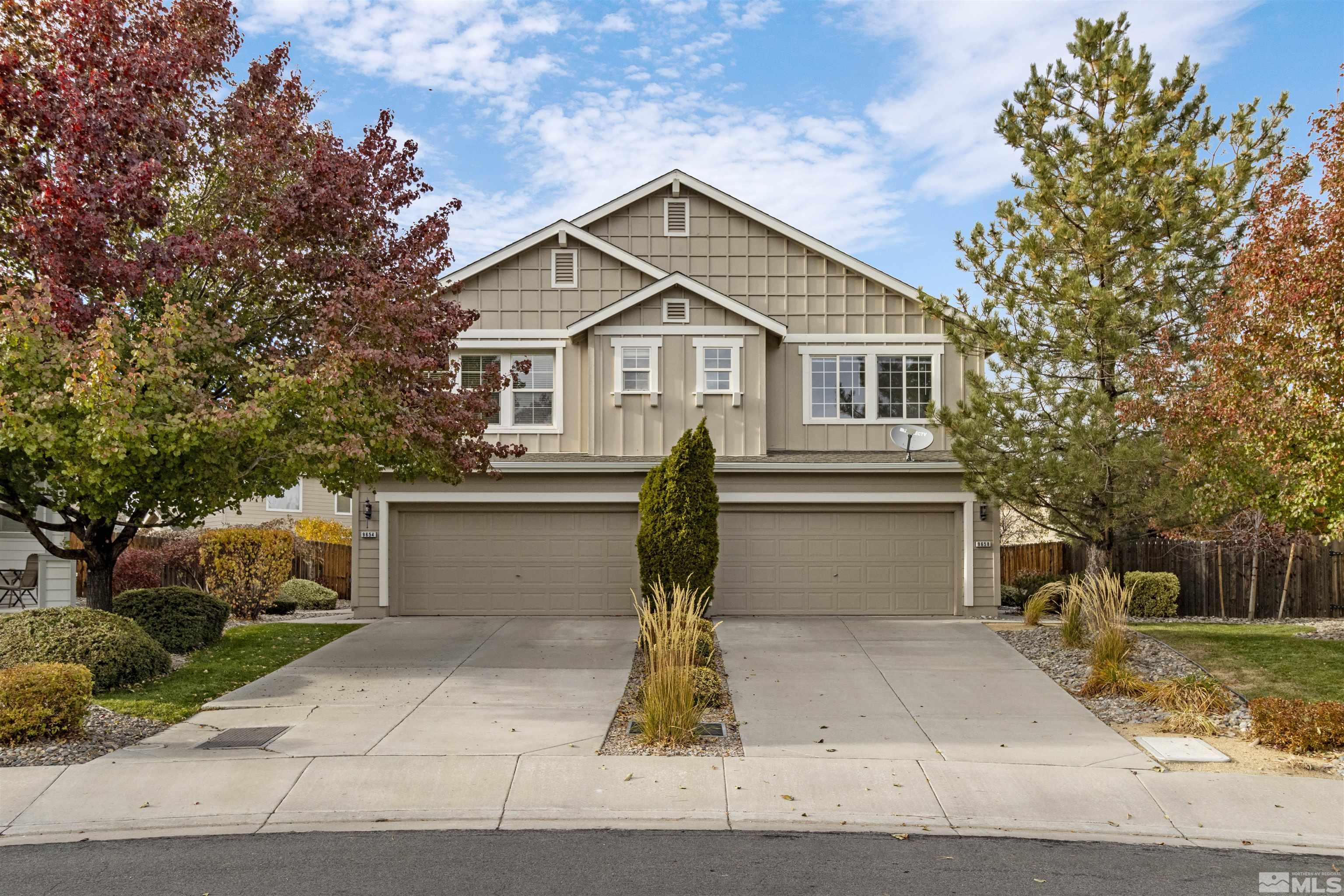 a front view of a house with garage