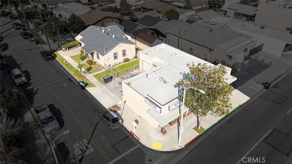 an aerial view of a house with a swimming pool